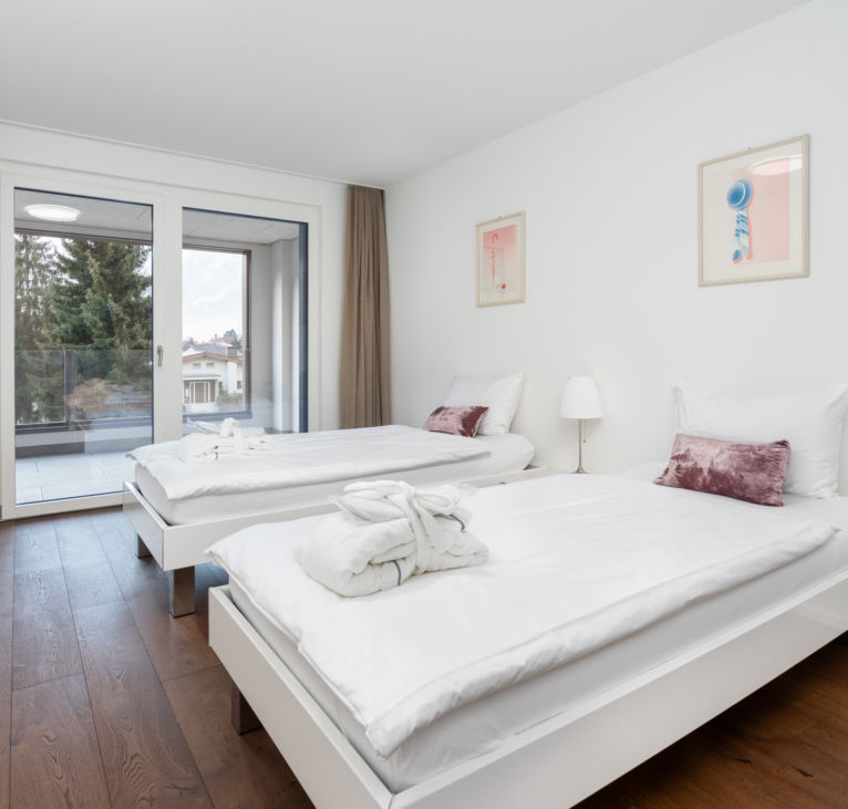 Twin bedroom accommodation by Interlaken Swiss Hotel Apartments