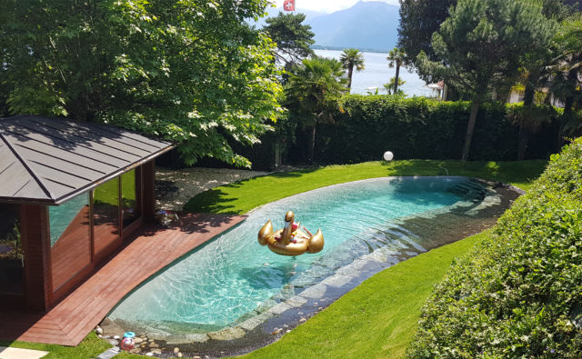 Swimming pool and garden area of Villa Rotana by Swiss Hotel Apartments