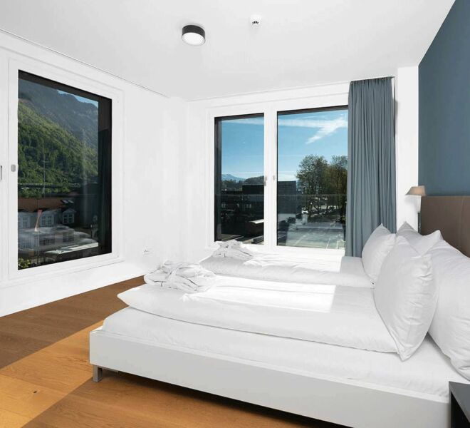 Chambre à coucher de l'Interlaken Swiss Hotel Apartments