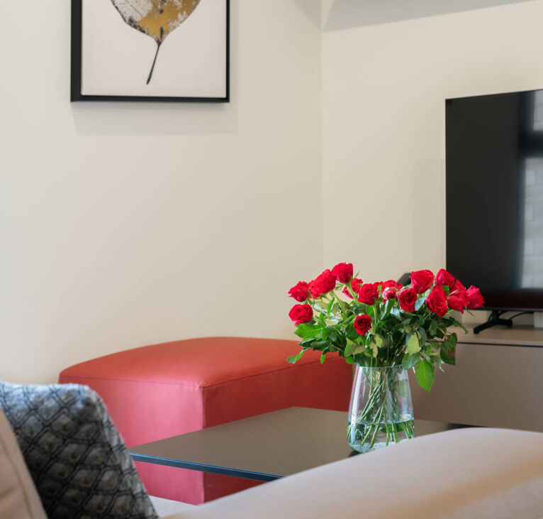 interior design detail of table with flowers in Lugano Swiss Hotel Apartments