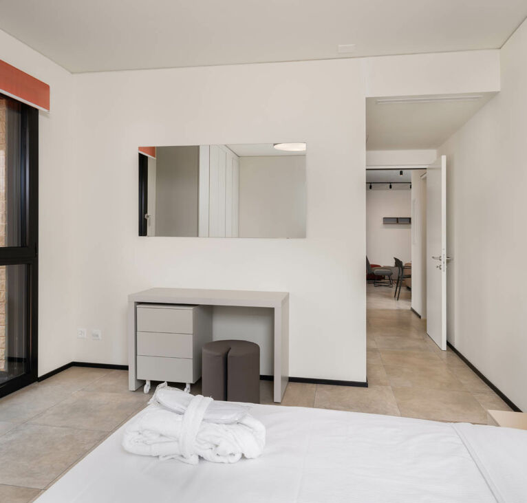 Bedroom and corridor in Lugano Two Bedroom Apartment-Swiss Hotel Apartments 01