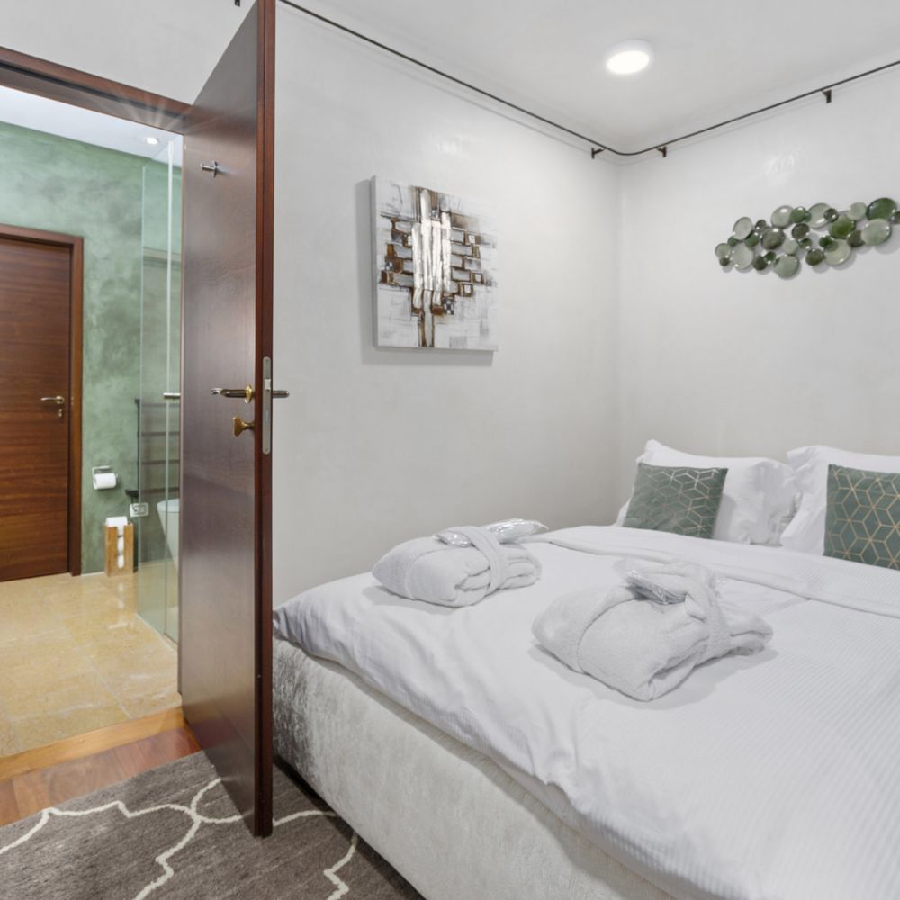 Bedroom furnishing of Villa Rotana by Swiss Hotel Apartments